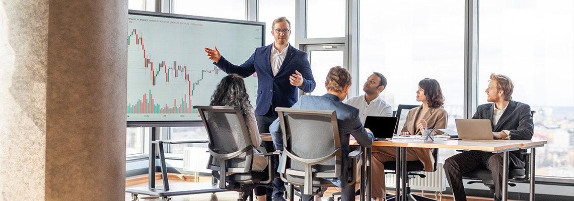 Businessman giving a presentation to his team