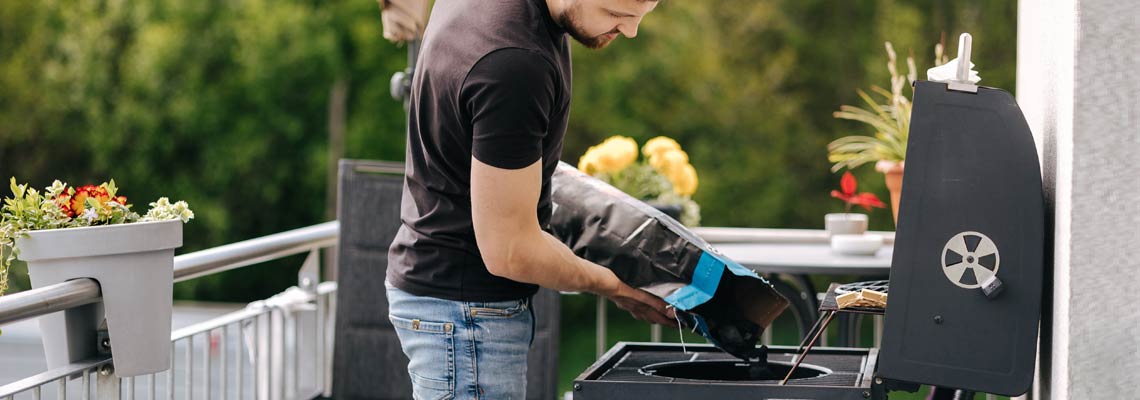 Man preparing for backyard barbecue
