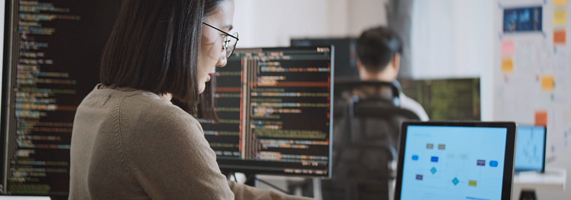 Woman programming on a computer