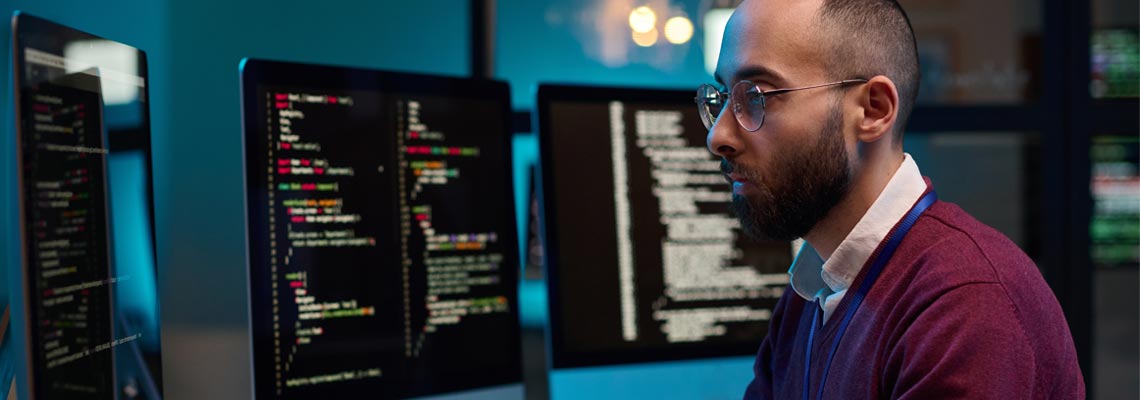 cybersecurity engineer typing at computer keyboard