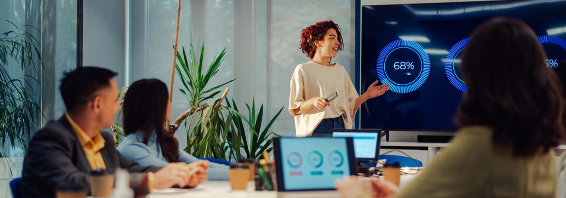 Female team leader presenting data to colleagues