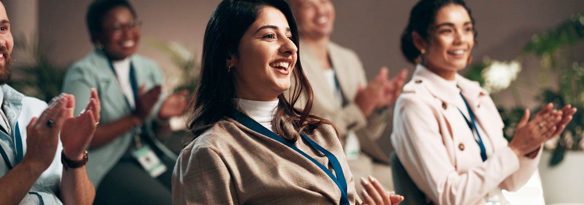 People clapping hands at the conference