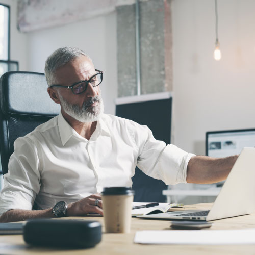 businessman using laptop while working at the modern  office