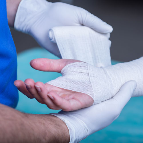 doctor bandaging a hand