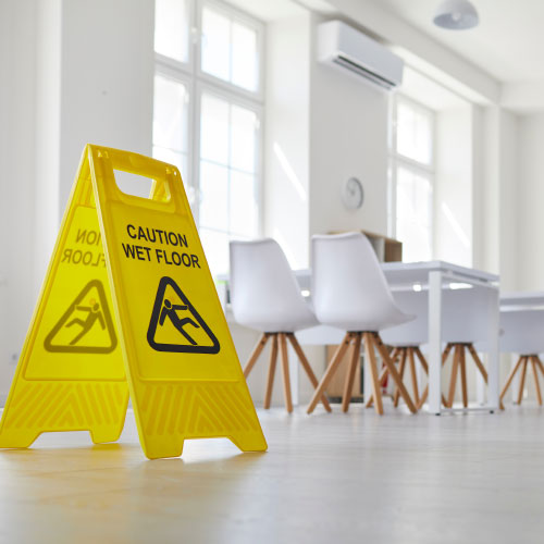yellow wet floor caution sign