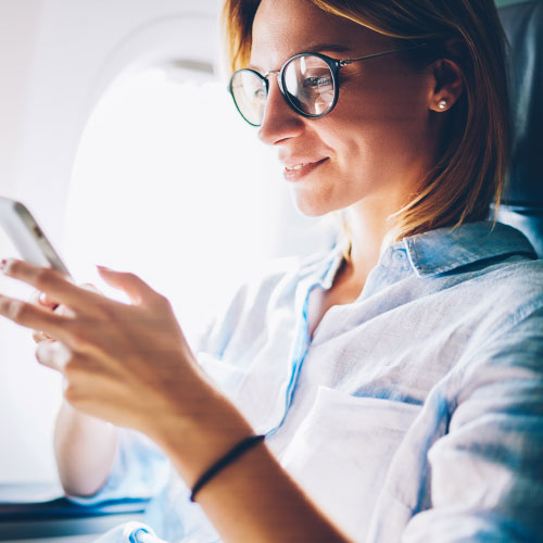 female passenger using smartphone 
