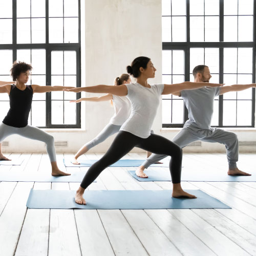 Group of multiracial people practising yoga