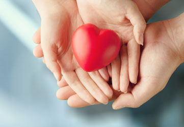 hands holding red heart
