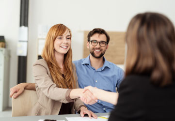 couple talking to a broker