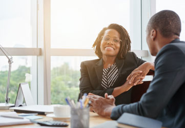 smiling business lady chatting with coworker