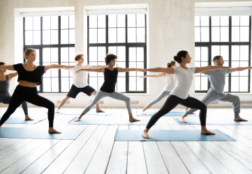 Group of multiracial people practising yoga
