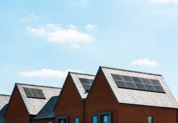 row of newly build houses with solar panels