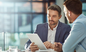 men with touchscreen planning sales