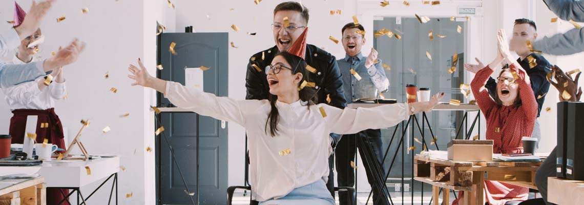 People in the office celebrating