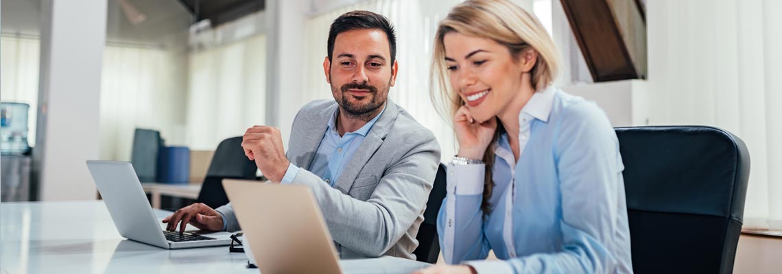 business people working on laptops at conference room