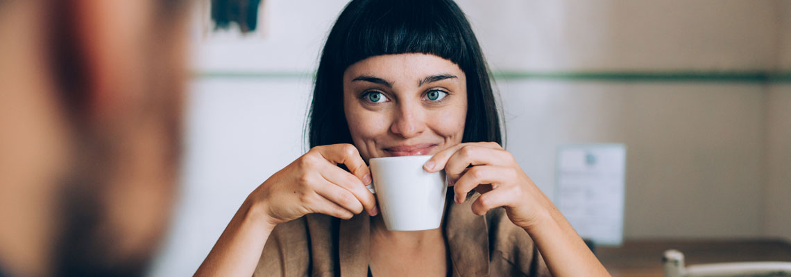 smiling woman drinking tea