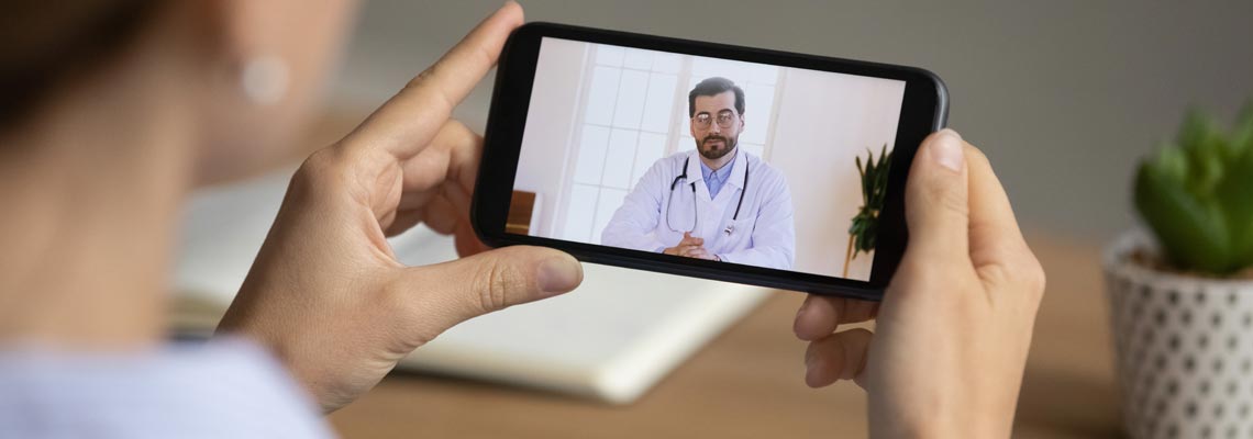 Woman having virtual consultation with GP