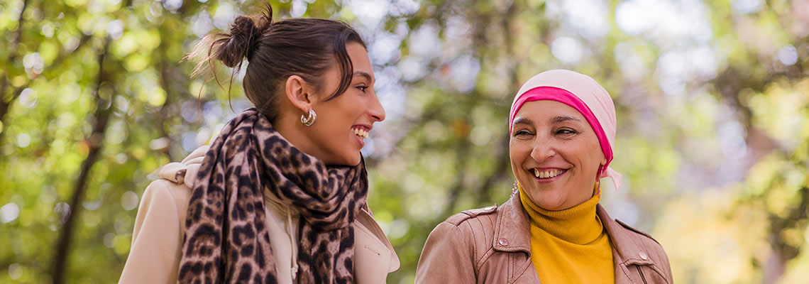 Cancer survivor mother and daughter enjoying a walk