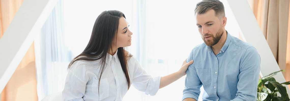Therapist speaking to a patient in a therapy session
