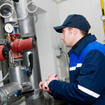 engineer checking pipe pressure