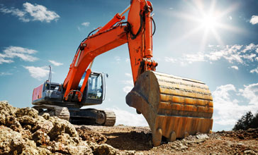 Crawler excavator front view digging on demolition site
