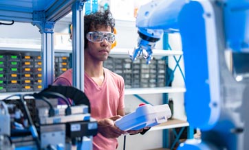 engineer using robotic machine