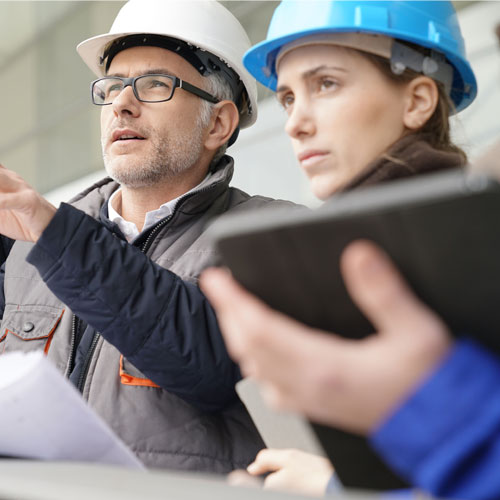 Instructor with young people in engineering training