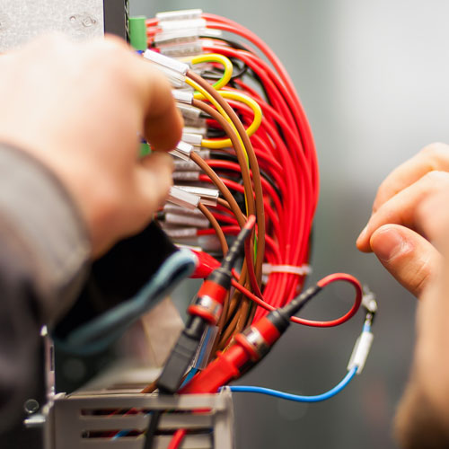 Electrician engineer tests electrical installations
