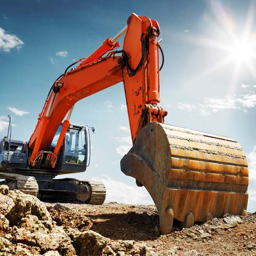 Crawler excavator front view digging on demolition site