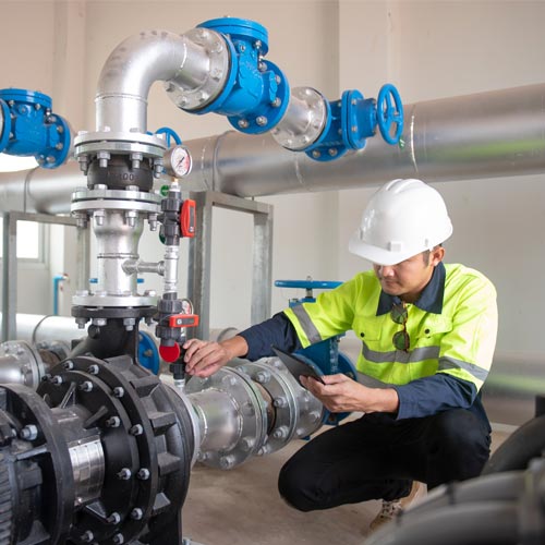 Engineer checking water pressure 