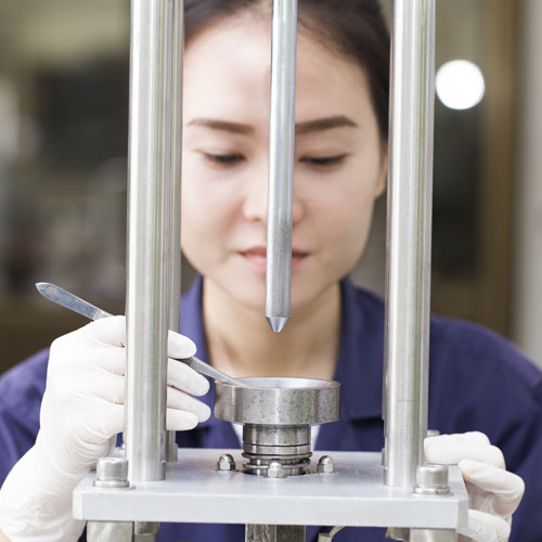 Engineer setting up testing machine