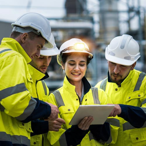 Team of engineers inspecting gas separation plant