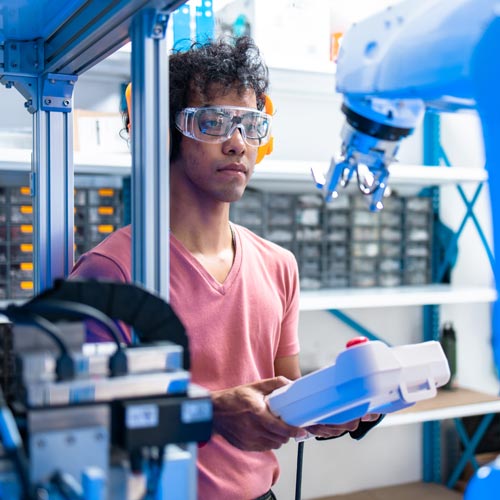 Engineer using robotic machine