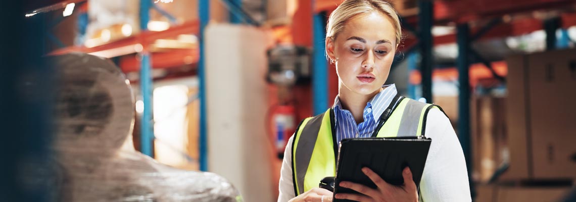 Woman doing inventory with tablet at the distribution centre