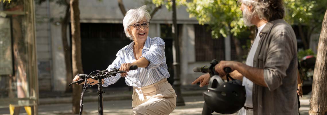Senior couple touring the city on ebike