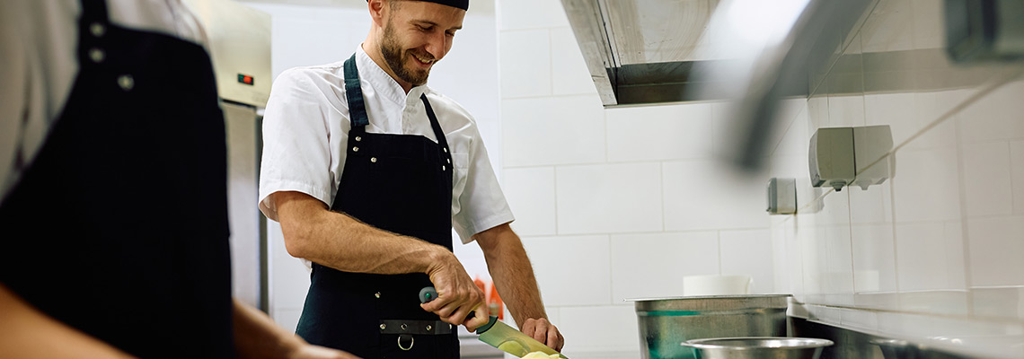 Cook preparing food in a restaurant kitchen