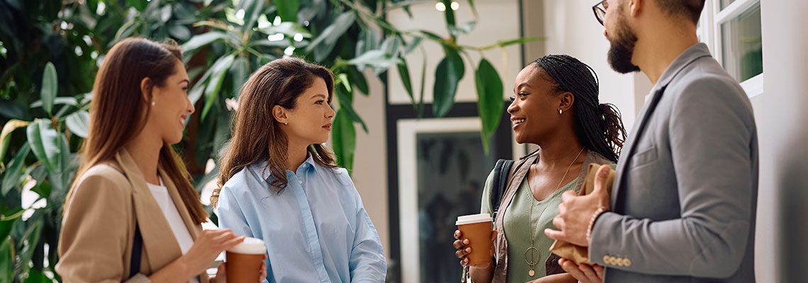Colleagues speaking in an office