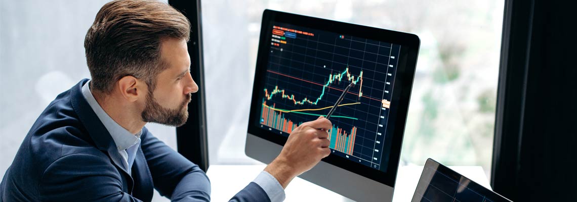 broker, sits at his work desk