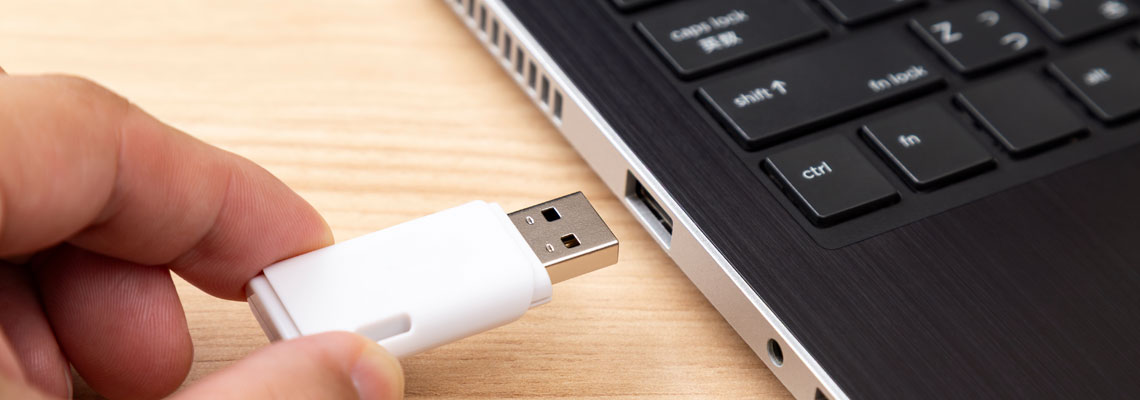 Inserting a USB memory stick into a computer