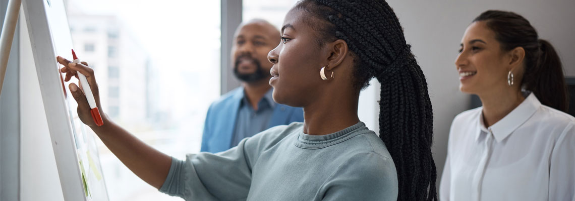 businesswoman writing on a whiteboard ideas