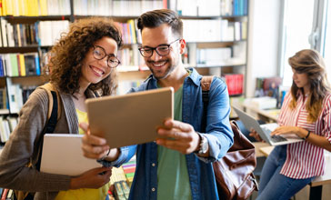 Group of students study at library
