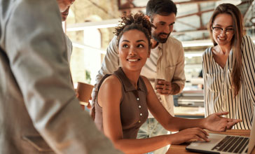 young woman talking to a senior manager
