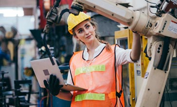 female engineer inspecting machinery