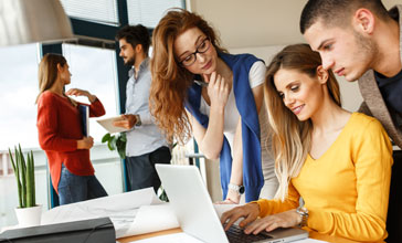 group of young people working together in the office
