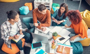 group of young people working together in the office