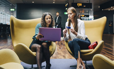 two female business professionals in the modern office