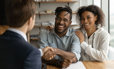 young couple with financial advisor