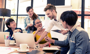 group of young people collaborating
