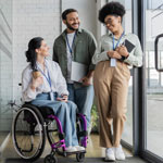 young woman on a wheelchair with colleagues