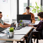 group of young people working together in the office
